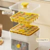 One-press release demo of beige ice cube tray, showing fast ice demolding with single button press One-press release demo of beige ice cube tray, showing fast ice demolding with single button press
