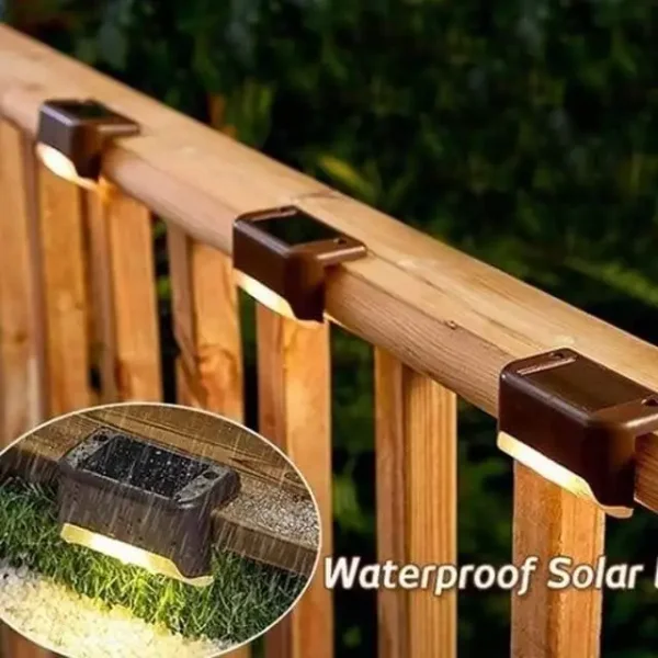 Brown Solar Step Lights on Deck Railing (Waterproof) Brown waterproof solar step lights installed on wooden deck railing, close-up view