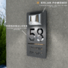 Solar-powered personalised house number plaque, custom address sign with LED light, charges in day and shines at night