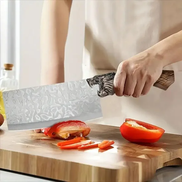 hand forged wolf head kitchen cleaver slicing red pepper vegetable wooden handle